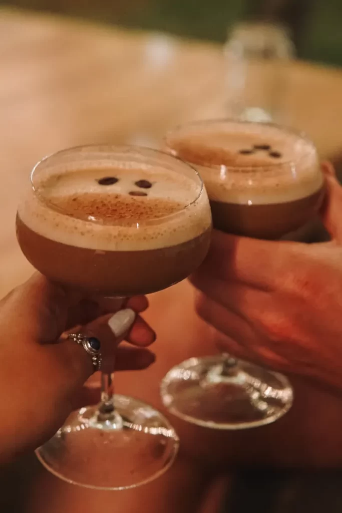 Two people cheersing some espresso martinis at Salty Swamis 