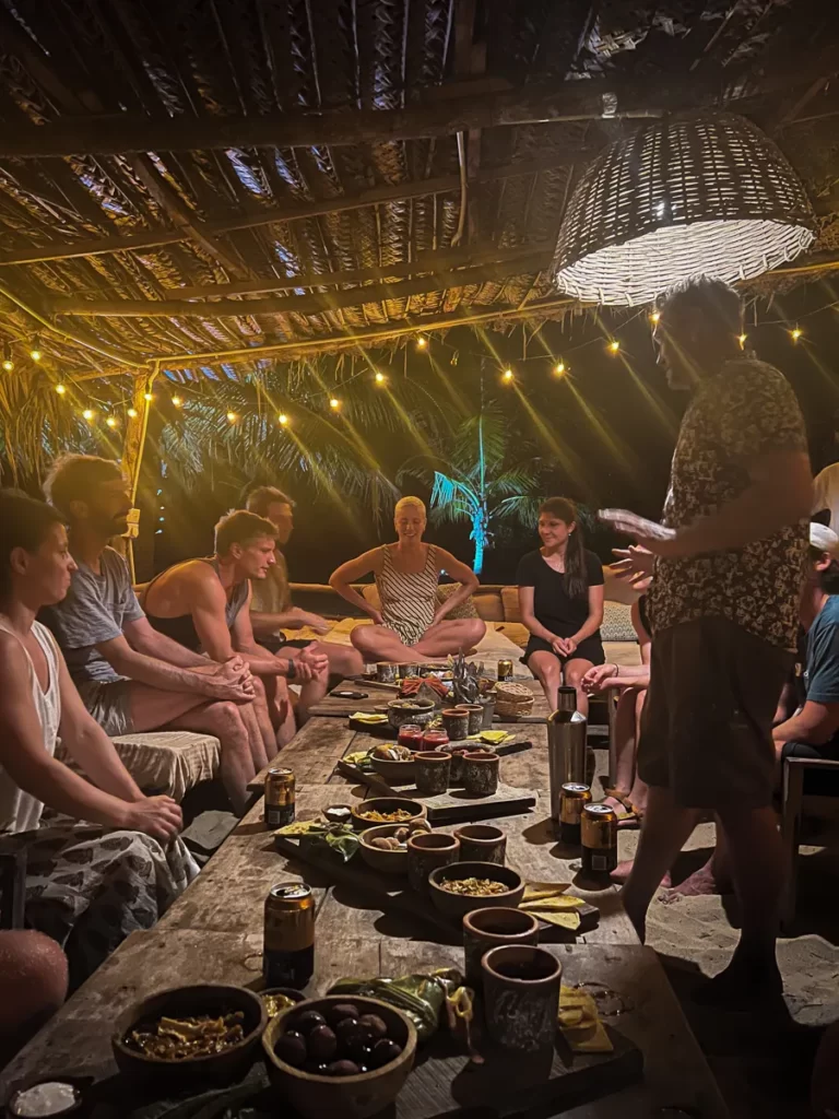 A group of travellers sharing a curry at Hilltop Cabanas near lighthouse beach