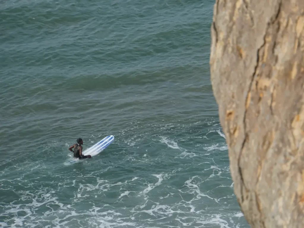 Longboarder staring out to sea waiting for a wave a Elephant Rock Surf Point Arugam Bay