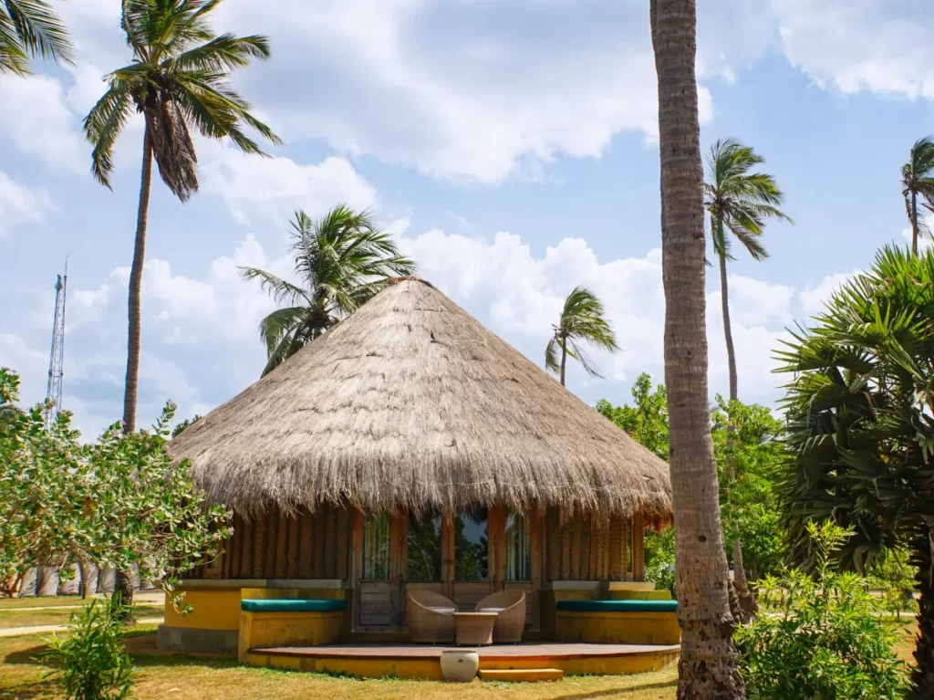 One of the cabanas including it's doors and terrace at Jetwing Surf