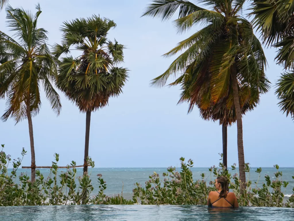 A girl looking over the edge of the pool at Jetwing Surf