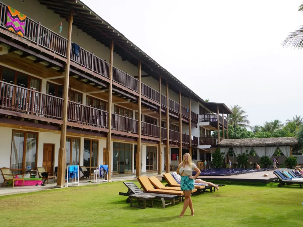 A girl standing in the garden near the pool at Timeless Villa