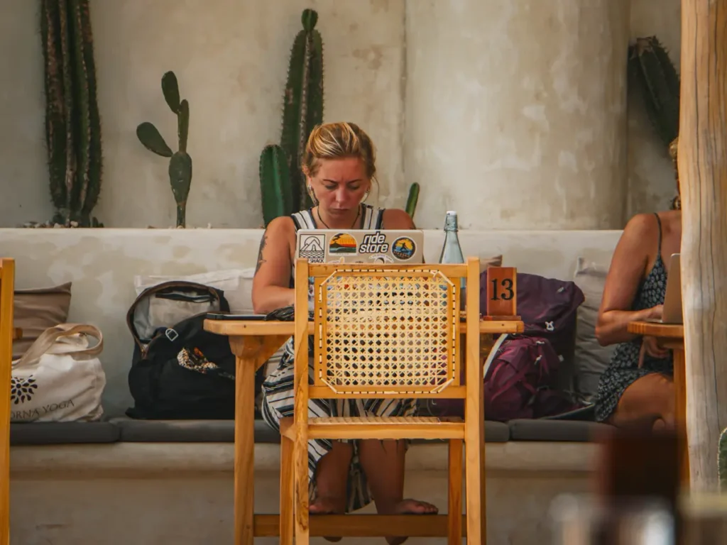 A girl working on her laptop in Cactus Ahangama