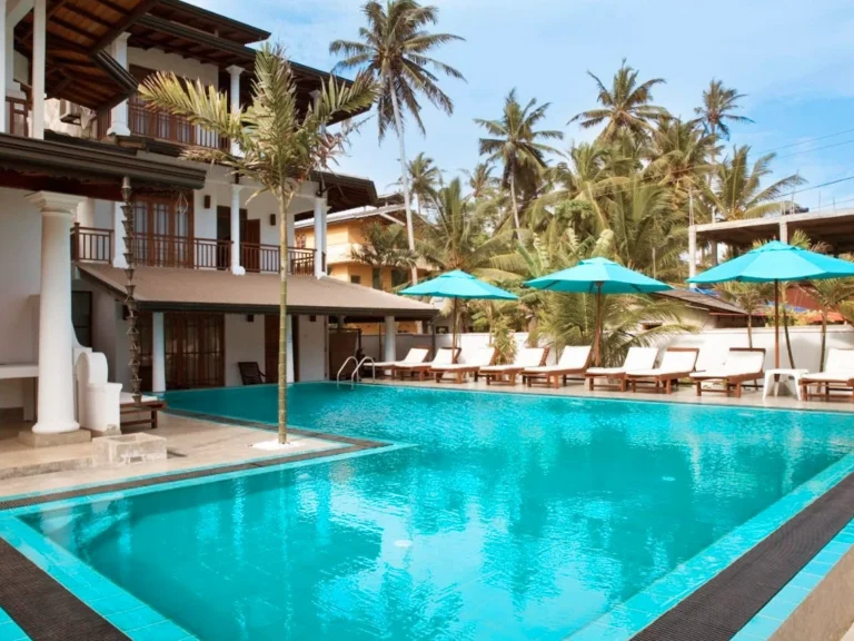 The pool and seating areas of Beach Inns Resort, a top place to stay in Madiha