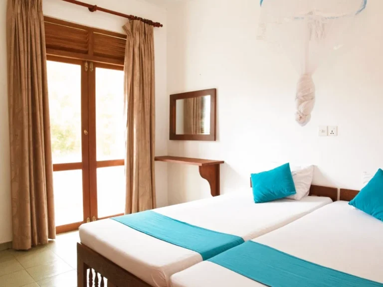 Twin rooms at Beach Inns resort near Madiha