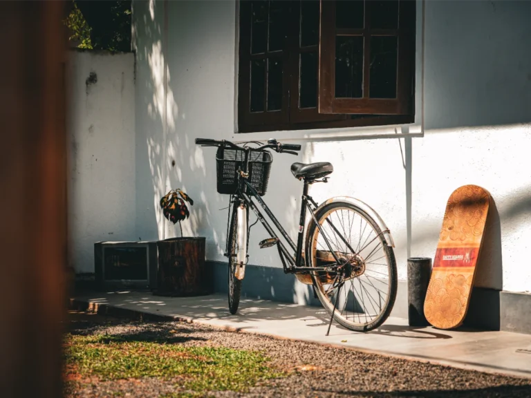 A bike and skateboard in the garden of Just Another Guesthouse in Madiha