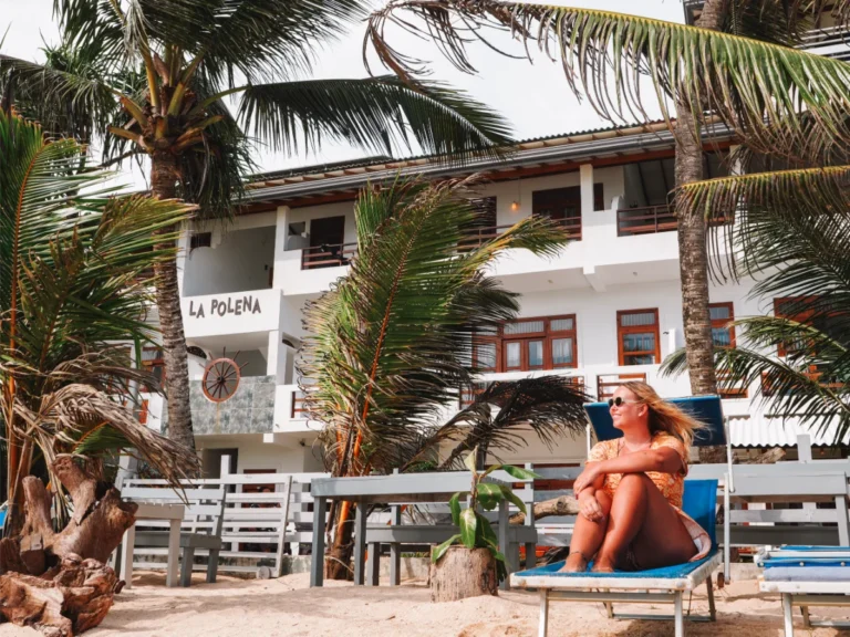 A girl sits on a sunlounger on the beach outside La Polena in Madiha