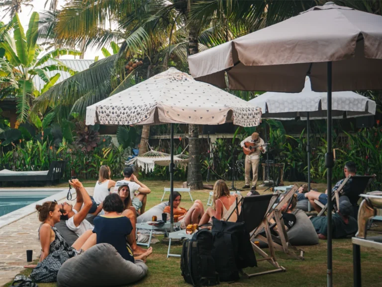 Travellers listening to live music at Spindrift hostel