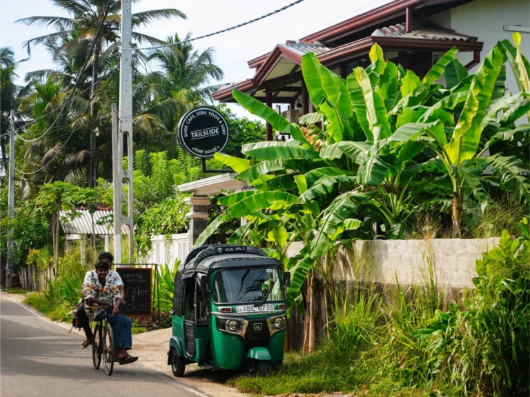 A man rides a bike past Tailslide in Madiha, a top place to stay in Madiha