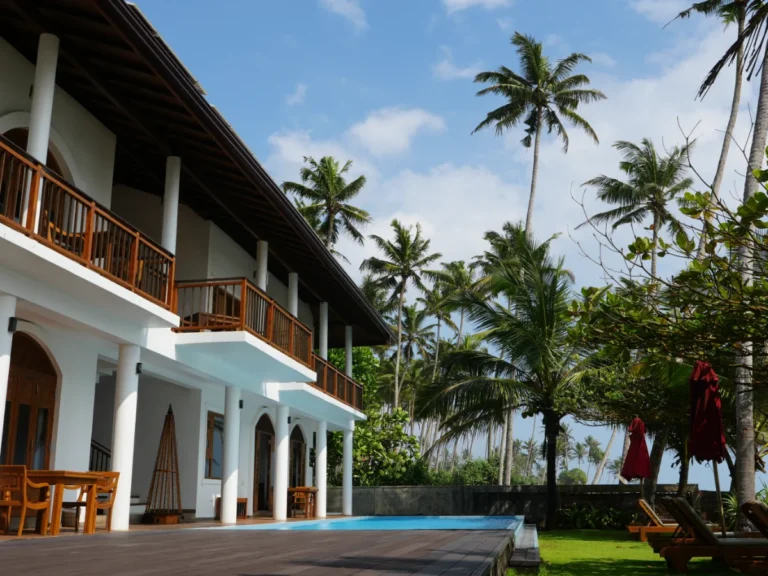 The pool and garden area of Villa Oceane, a top place to stay in Madiha