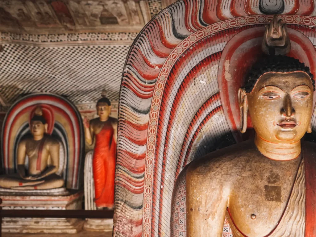 A close up photo of the intricate artwork on the Buddha statues at Dambulla Cave Temple, a must see