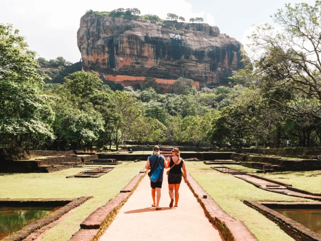 A couple explore Lion's Rock fortress, one of the top things to do in sigiriya