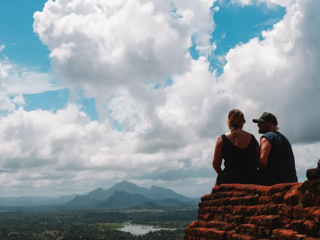 A couple looks at the views from the top of Sigiriya 